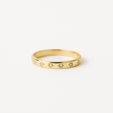 Gold Tone Band Ring with Star Pattern and Small Clear Stone Details