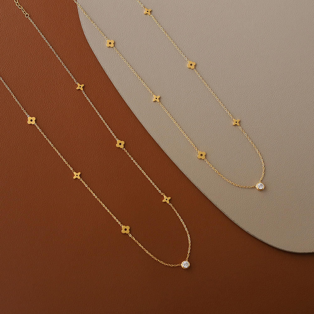 Gold-Tone Necklace with Polished Floral Motifs and Center Crystal Accent