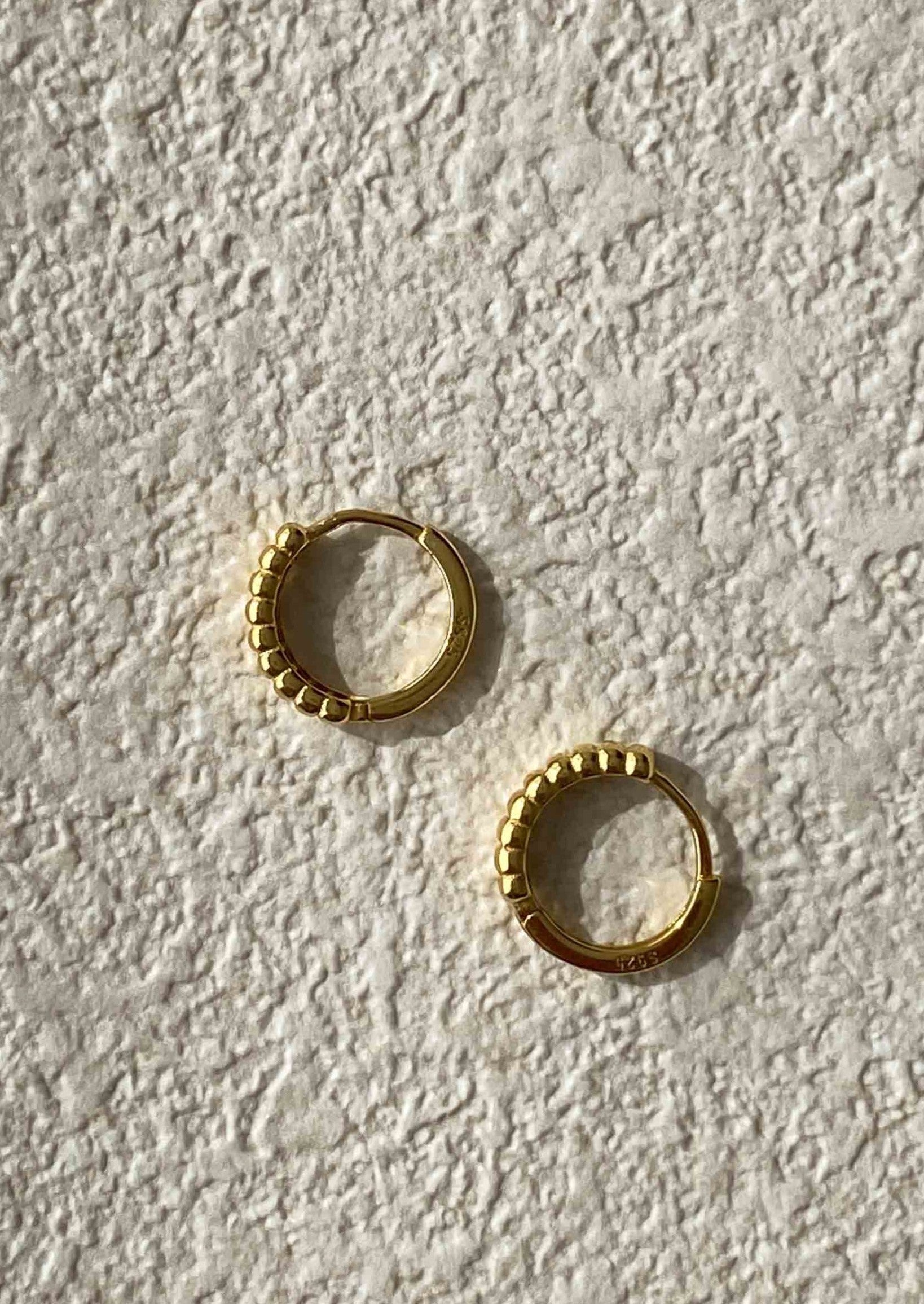 Gold tone Textured Huggie Earrings