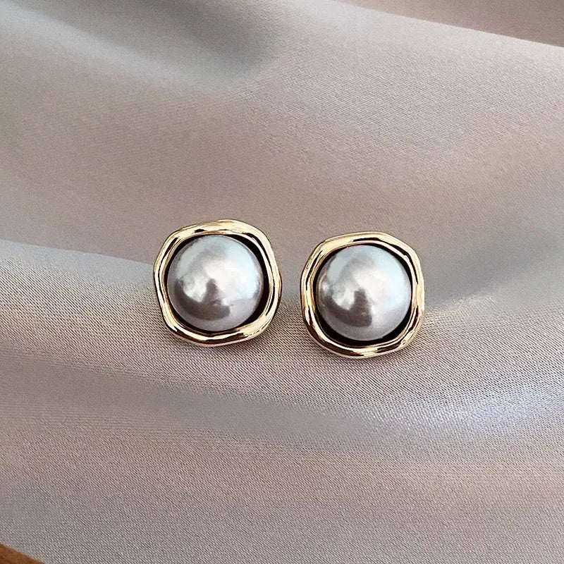 Gold Framed Round Stud Earrings with Black Pearls