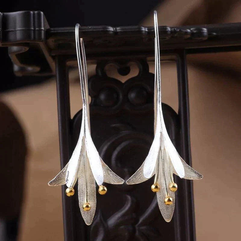 Long Silver Floral Drop Earrings with Gold Bead Accents