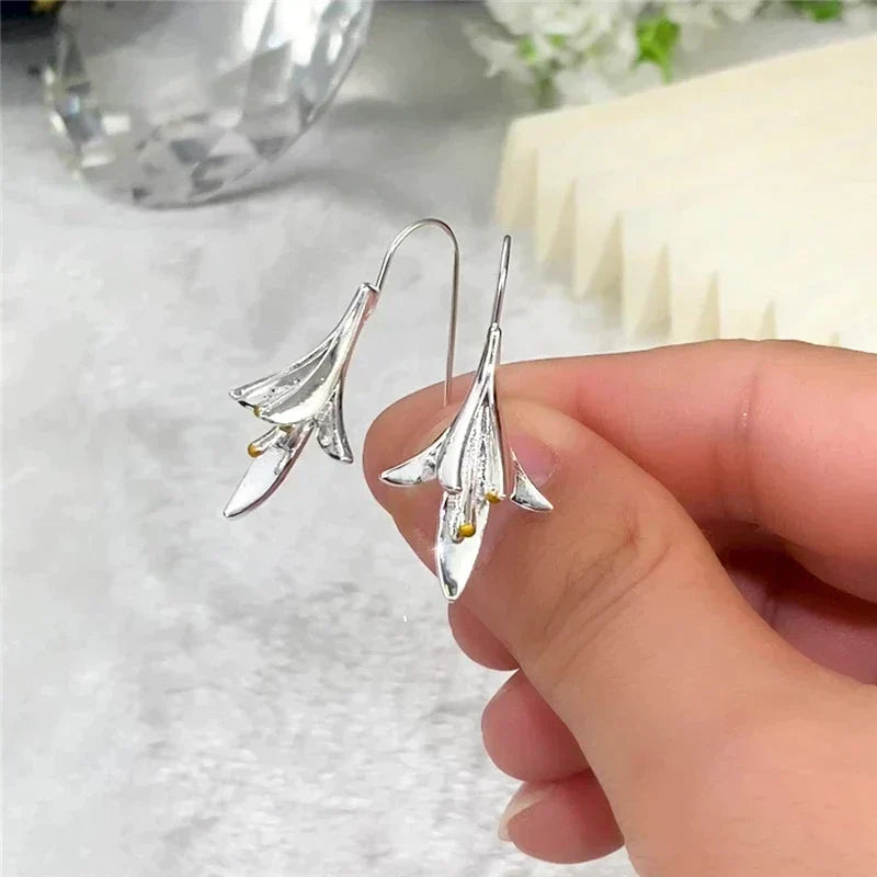 Long Silver Floral Drop Earrings with Gold Bead Accents