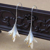 Long Silver Floral Drop Earrings with Gold Bead Accents