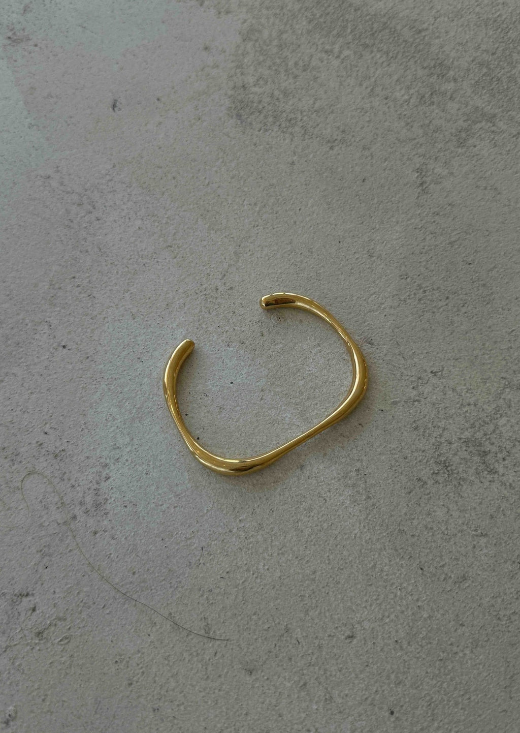 Polished Gold Open Bangle with Subtle Irregular Shape