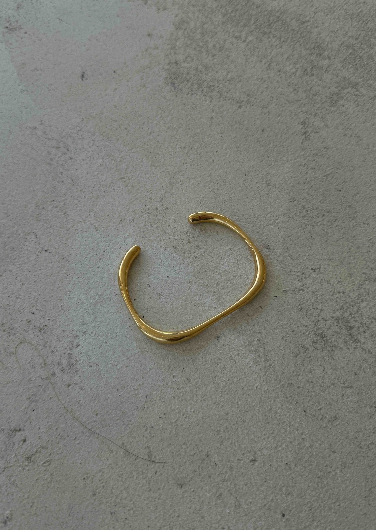 Polished Gold Open Bangle with Subtle Irregular Shape