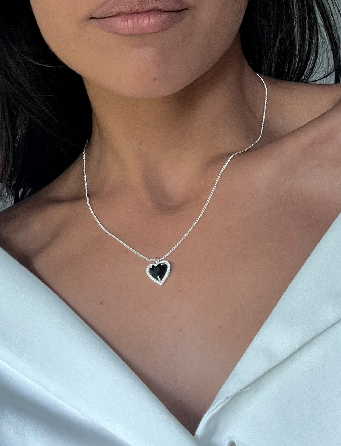 Silver Heart Pendant Necklace with Black Center Stone design