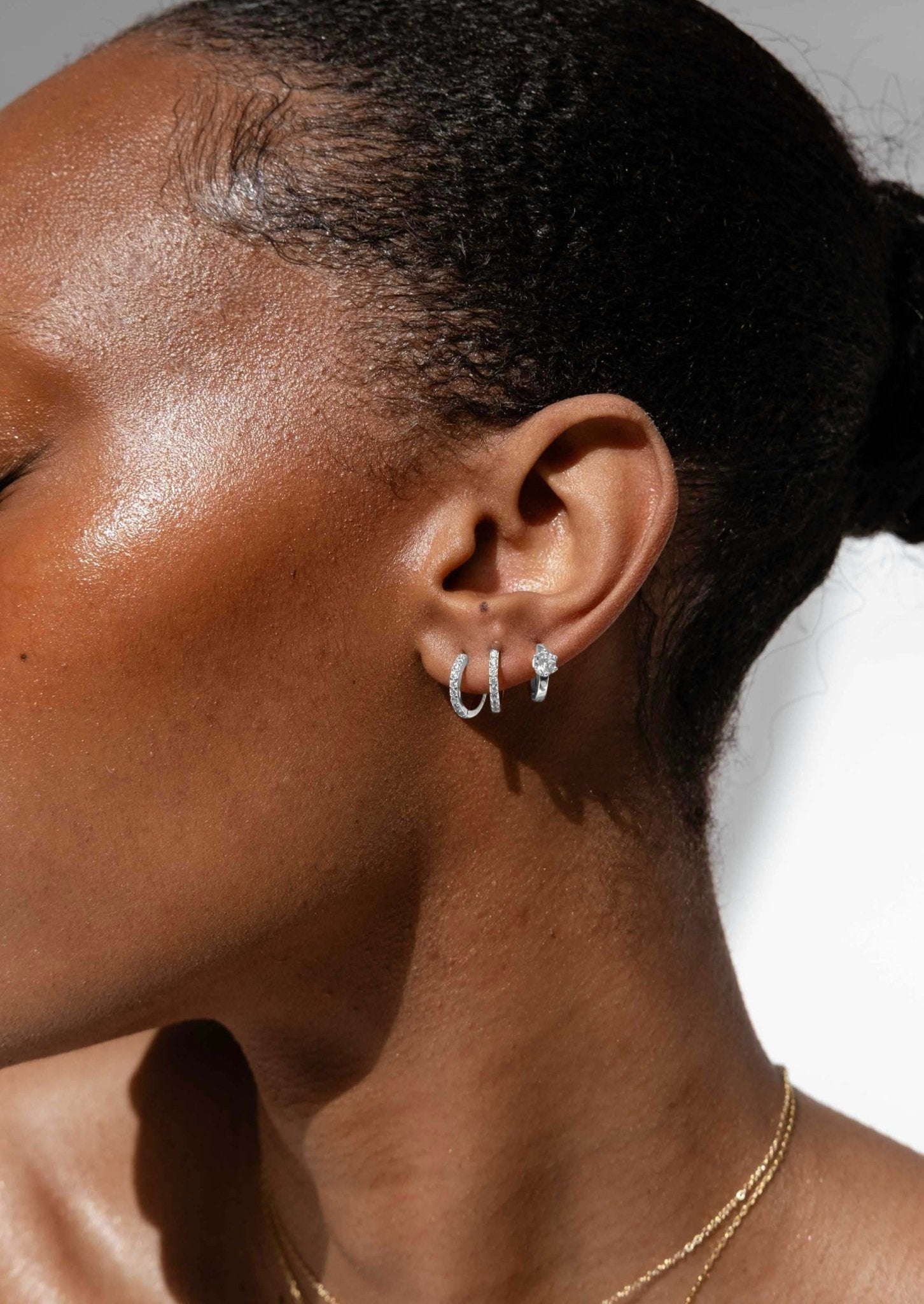 Silver Huggie Earrings with Solitaire-Style Zirconia design