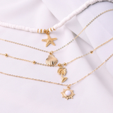 Layered Gold Necklace with Beach Charms and Pearls