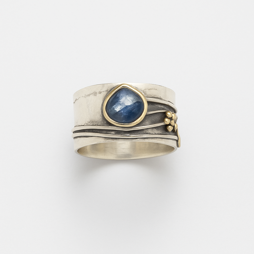Wide Band Silver Ring with Blue Gem and Mixed Metal Details