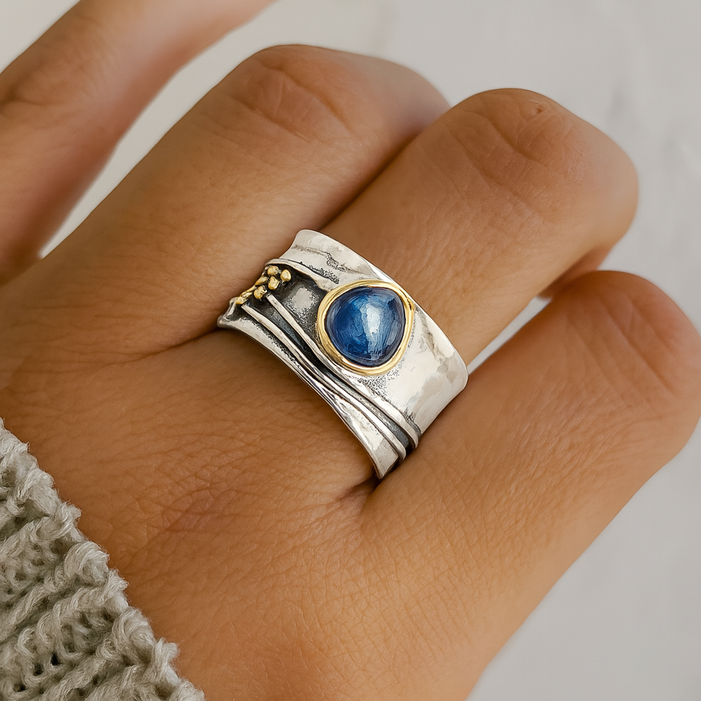 Wide Band Silver Ring with Blue Gem and Mixed Metal Details