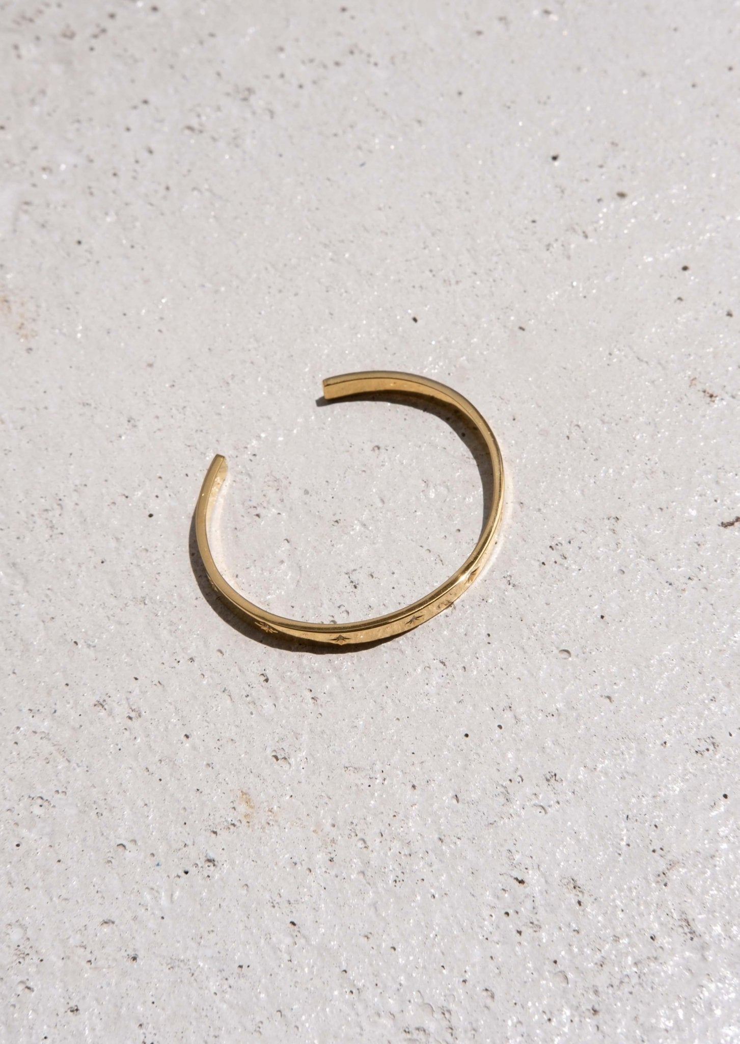 Gold Bangle Bracelet with Star-Set Detailing