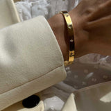 Gold Tone Bangle Bracelet with Star Detailing
