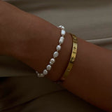 Gold Tone Bangle Bracelet with Star Detailing