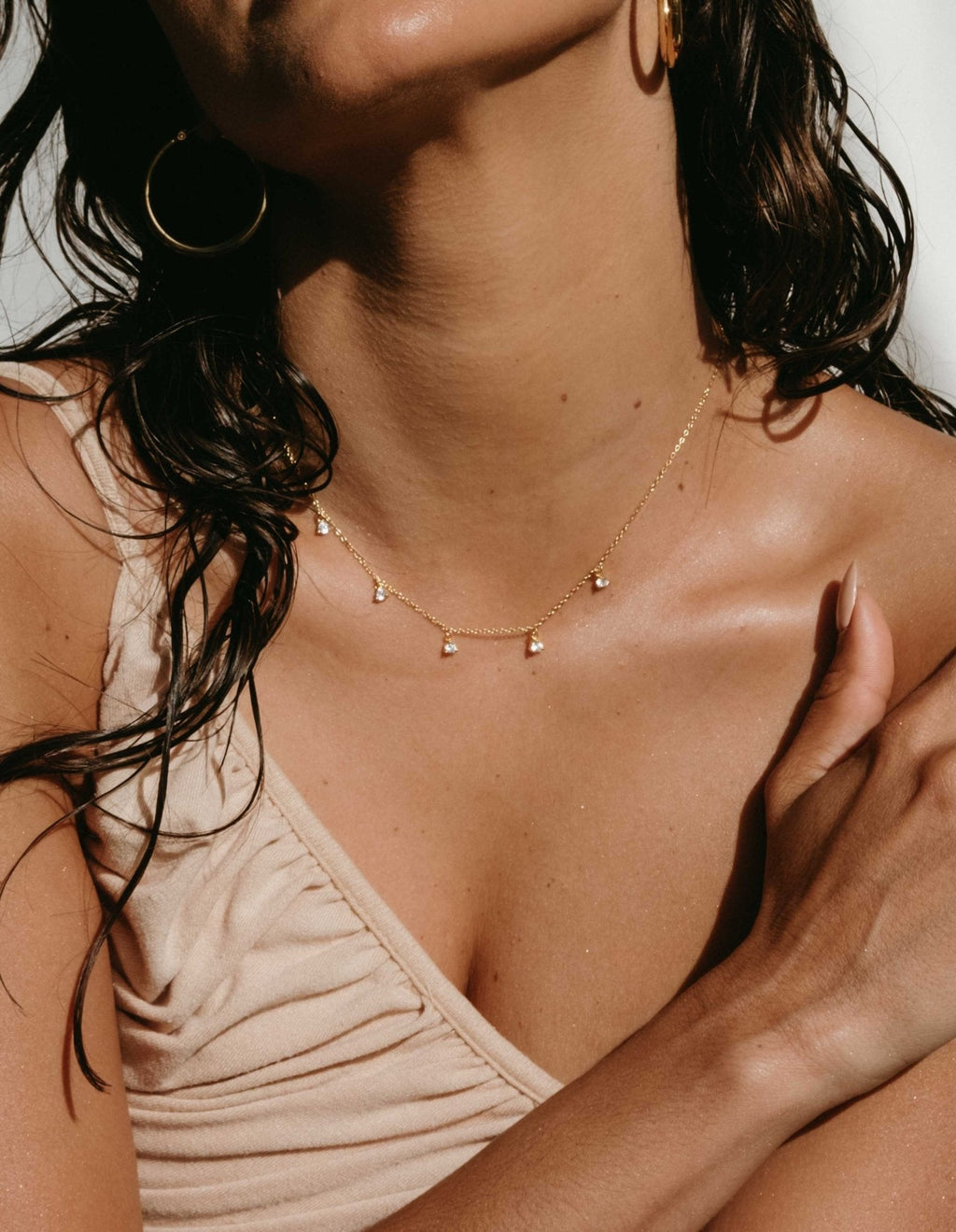 Gold-Toned Necklace with Five Dangling Round Stones